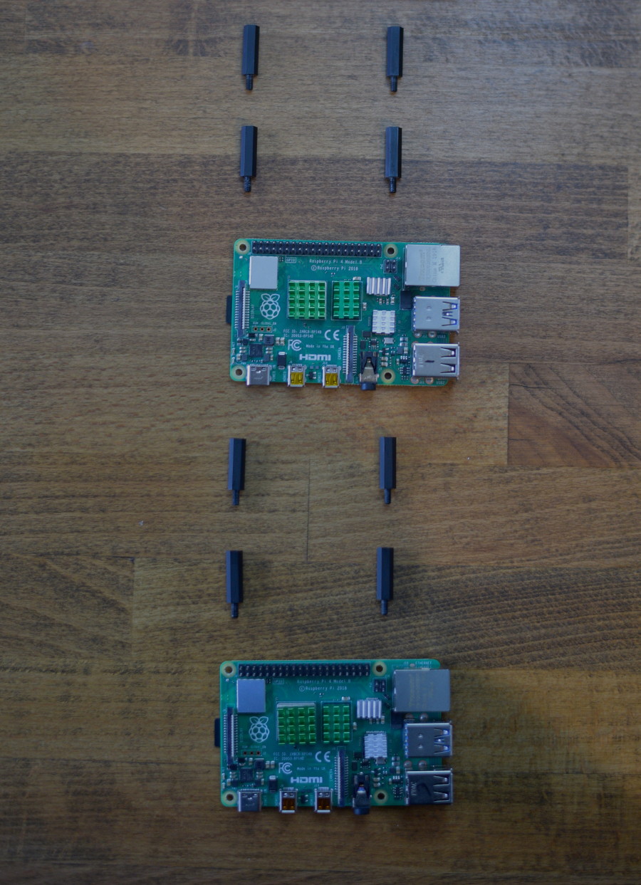 Hardware parts for Pi 2 and Pi 3 laid out on table